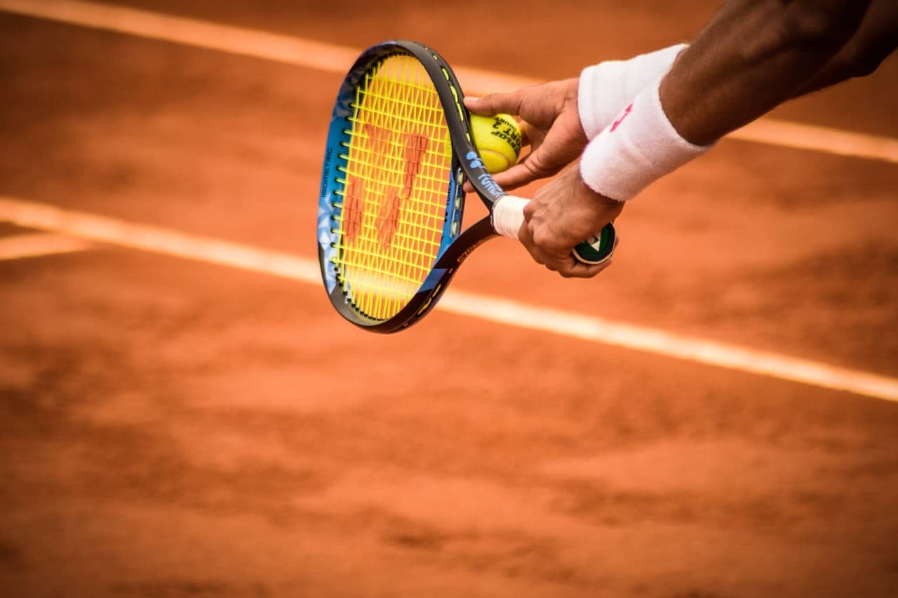 What should I consider when choosing a tennis racket?