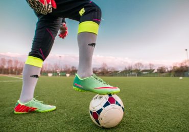 How do you properly match soccer shoes to the type of surface?
