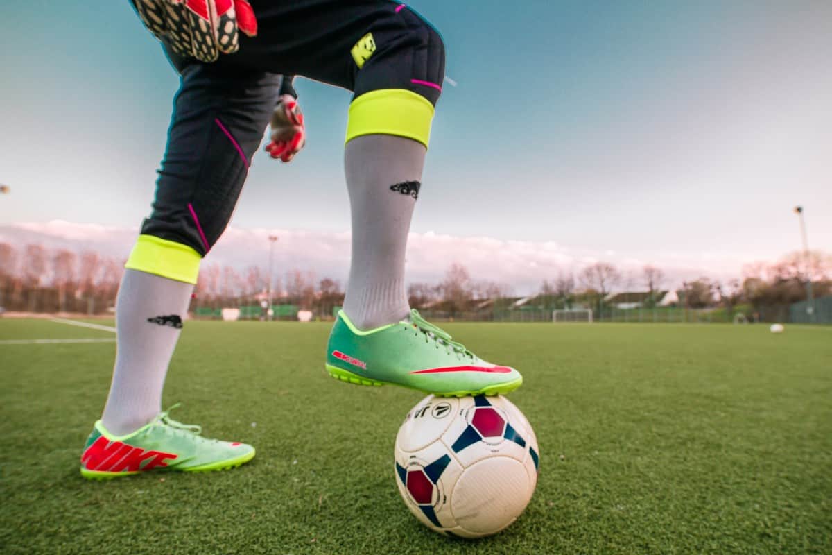 How do you properly match soccer shoes to the type of surface?
